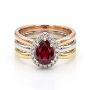 Anello multi-gambo Rubino centrale in tre Ori18kt